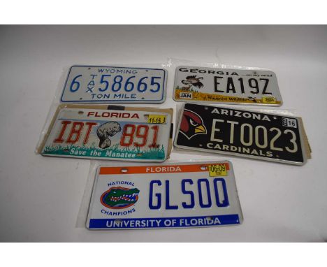 Five various American number plates