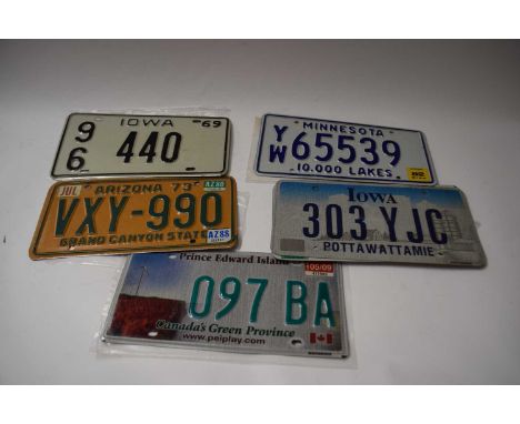 Five various American number plates
