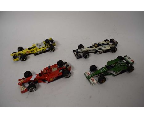 Four Mattel Formula 1 racing cars