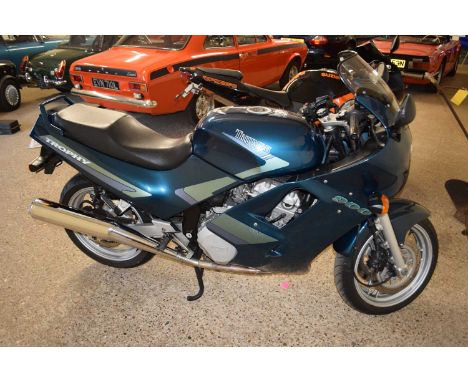 1991 Triumph 900 TrophyThe two-wheeler sports a four-stroke, liquid-cooled, 885cc, transverse three cylinder engine and a six