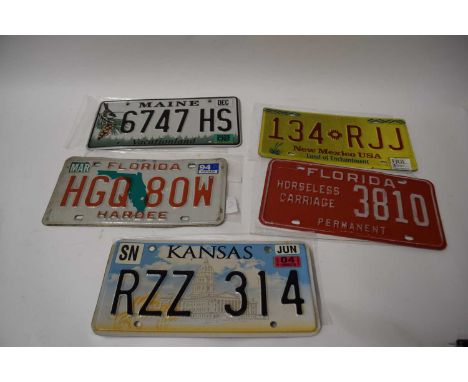 Five various American number plates