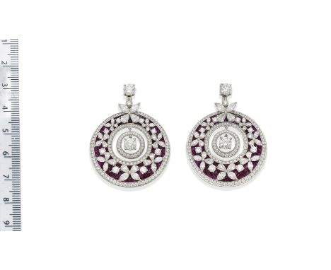 A pair of ruby and diamond 'Butterfly Motif' hoop earrings, by GraffEach hoop with circular-cut ruby ground overlaid with var