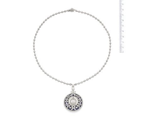 A diamond and sapphire pendant necklace, by GraffThe brilliant-cut diamond-set drop of target design suspended within a circu