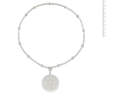 A diamond pendant necklace, by GraffThe pendant of  concentric circle design with a central brilliant-cut diamond, weighing 1
