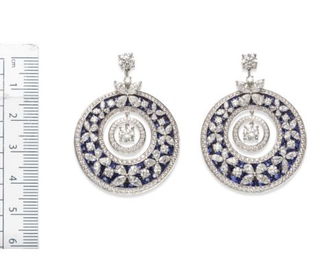 A pair of sapphire and diamond pendent earrings, By GraffThe brilliant-cut diamond-set drop of target design suspended within