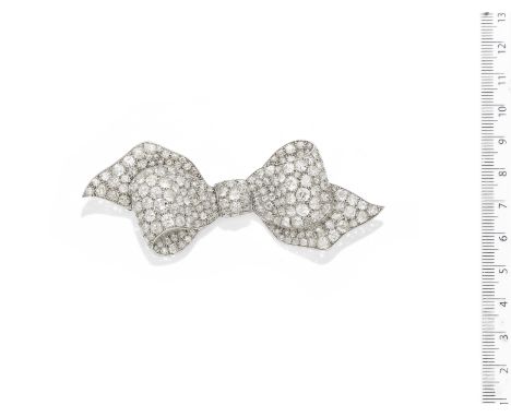 A diamond bow brooch, circa 1930The highly sculptural bow pavé-set throughout with old brilliant-cut diamonds, mounted in pla