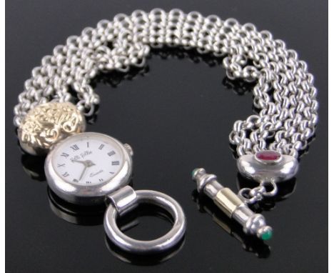 A lady's Folli Follie wristwatch,silver case with multi strand belcher link bracelet and 18ct gold heart mount, set with ruby