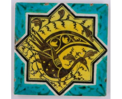 An Islamic glazed polychrome ceramic tile,with painted bird design, 20cm across.