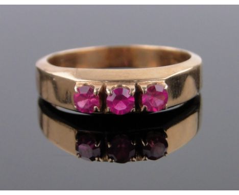 A continental gold 3 stone ruby ring,size M.
