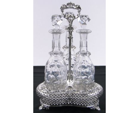 An electroplate 3 bottle decanter stand,with pierced sides and grapevine moulded edge, containing 3 mallet shaped cut-glass d