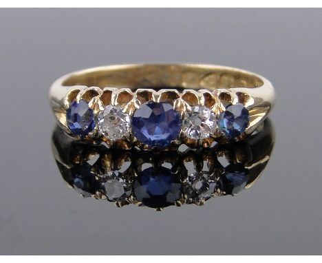 An 18ct gold 5 stone sapphire and diamond ring,size O.