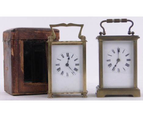 A brass cased carriage clock,dated 1918 in leather travelling case together with another French brass carriage clock, (2).