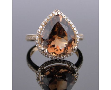 A 14ct gold pear-cut champagne topaz and diamond ring,topaz approx. 7.43cts, total diamond content approx. 0.34cts, setting h