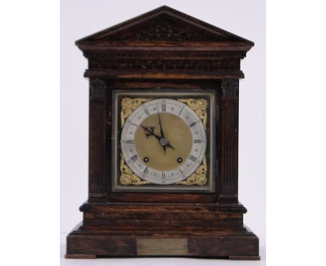 A Victorian carved oak cased architectural mantel clock,8-day striking movement, height 41cm.