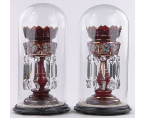 A pair of 19th century ruby glass table lustres under glass domes,with hand painted butterfly and floral designs and cut-glas