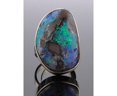 A large 14ct gold and natural opal set ring,setting height 30mm, 15.9g, size L.