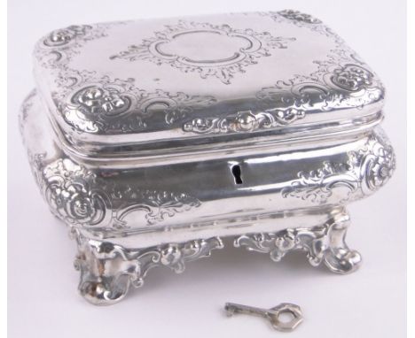 An unmarked 19th century French white metal jewel casket,ogee shaped sides with relief floral designs and bracket feet, lengt