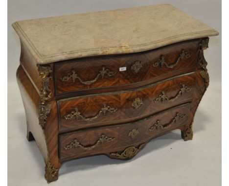 A French Kingwood marble topped Bombe commode in Louis XVI style,elaborate cast ormolu mouldings and mounts, width 3'7".