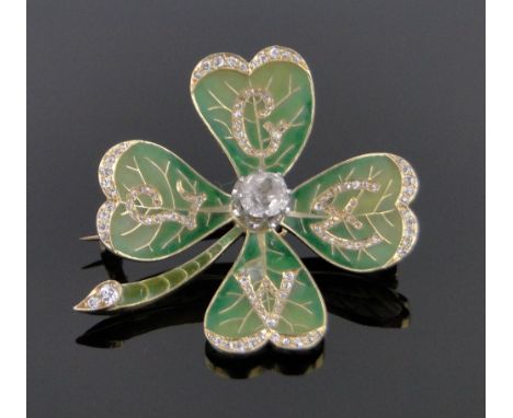 An unmarked gold diamond and plique-a-jour enamel four leaf clover design brooch,circa 1900, each leaf having diamond initial