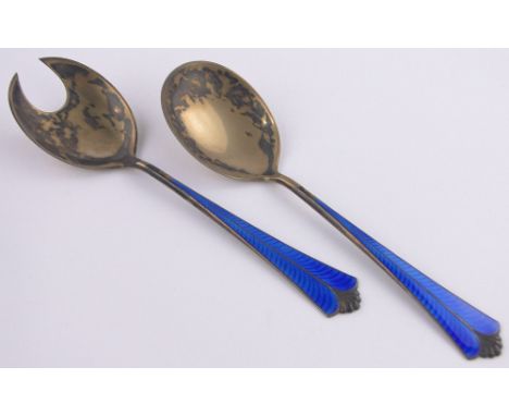 Pair of Norwegian silver gilt and blue enamel serving spoons,by D Andersen, length 20cm.