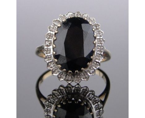 A large 9ct gold sapphire and diamond cluster ring,setting height 18mm, size R.