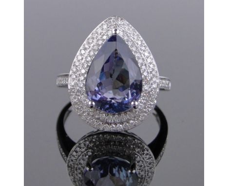 A 14ct white gold pear-cut tanzanite and diamond cluster ring,tanzanite approx. 4.23cts, total diamond content approx. 0.6cts