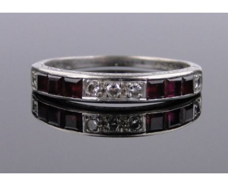 An 18ct white gold square-cut ruby and diamond set half eternity ring,size T.