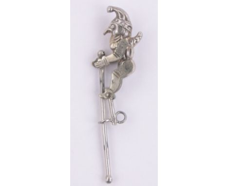 A miniature unmarked silver acrobatic Mr Punch stick pin,length 35mm.