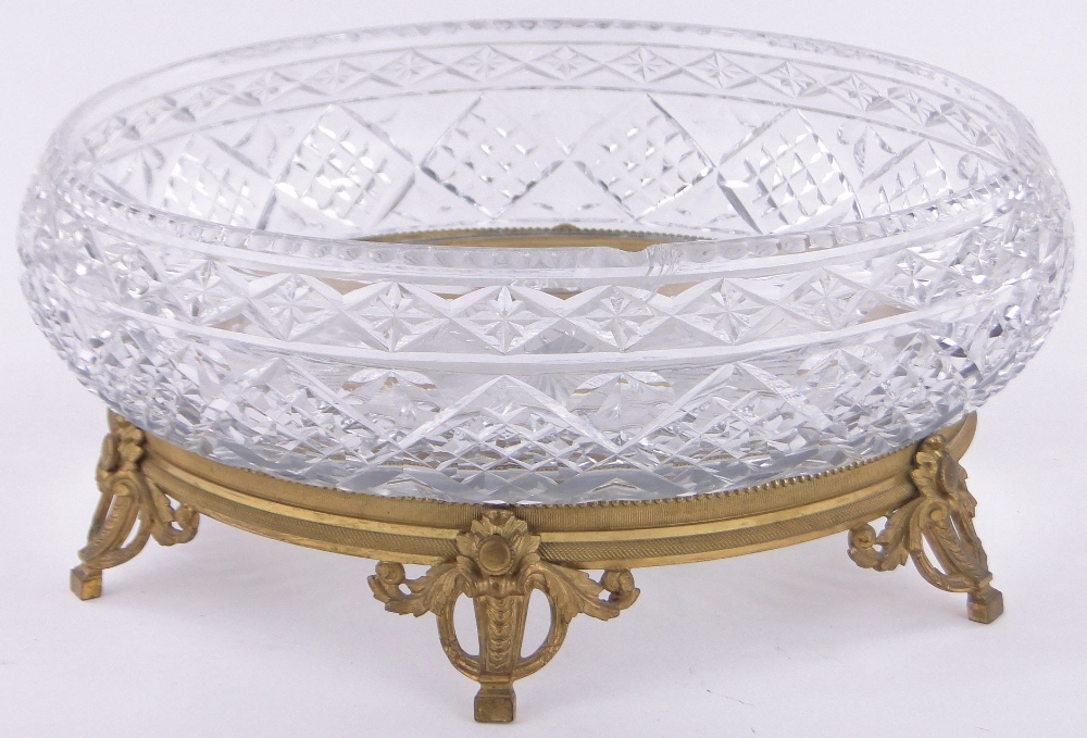 A large cutglass table centre bowl on ornate cast ormolu stand