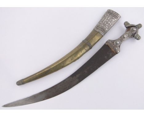 A Middle Eastern curved dagger,ornate silver filigree and brass decoration with scabbard, length overall 58cm.