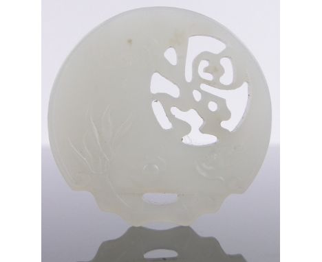 A Chinese relief carved and pierced jade disc pendant,diameter 5.5cm.