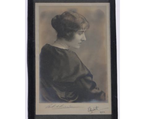An original photographic portrait of Elizabeth the Queen Mother,signed in ink "Elizabeth 1922", also signed by the photograph