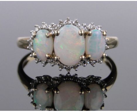 A 9ct gold opal and diamond cluster ring,size T.