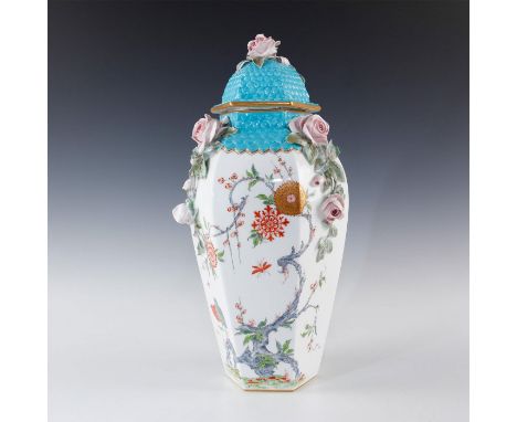 Profuse raised floral decorations of roses. Gilt and turquoise.Glazed white porcelain, hexagonal six-sided shape with turquoi