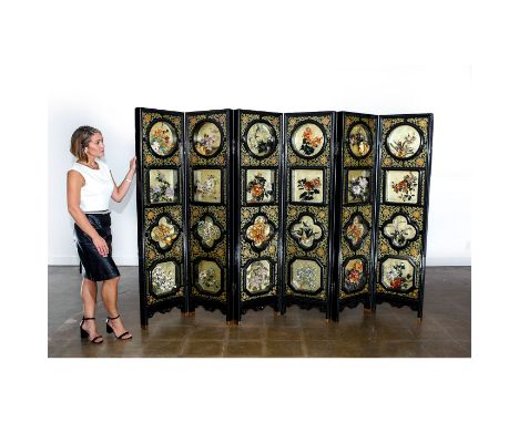 Six heavy, black lacquered wood panels, pink quartz, agate, jade, aventurine and other stones.A large folding screen free-sta