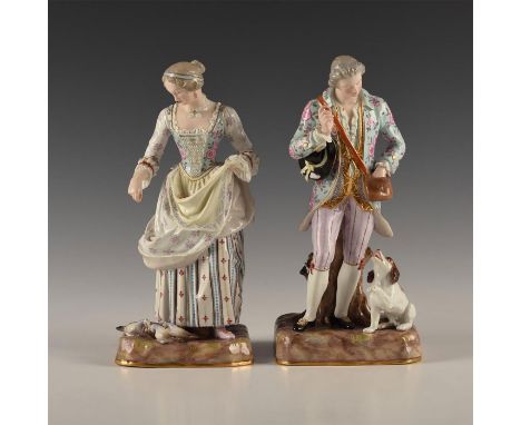 Standing figures in stylish period fashion, showing a variety of patterns. Female feeding doves from apron. Male give treat t