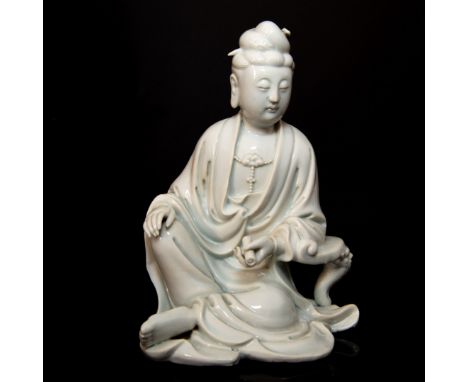 Beautifully robed figure with left arm leaning stool scroll in hand.Fine details of hair beaded necklace and even fingernails