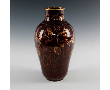 Brown glazed floral vase with gilt accents and gilt to rim.A very unusual chocolate brown glazed floral vase with gilt accent