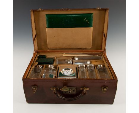 Large Silver/Crystal/Leather Toiletry set in leather caseThis large leather carrying cases holds numerous travelling toiletry