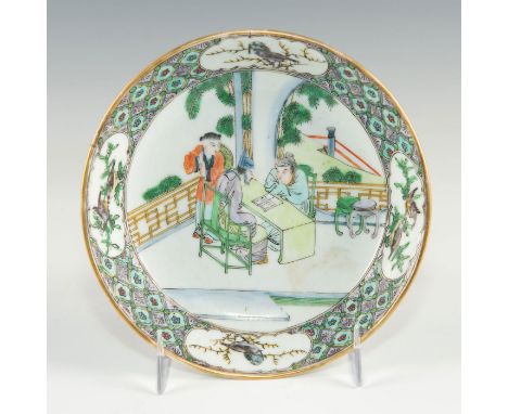 Colorful dish with wide band of pattern and main center depicting group reading.Highly patterned quatrefoil ground with 4 pla