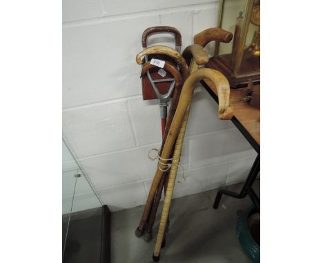 A selection of walking sticks and shooting stick