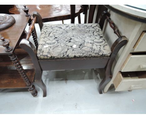 An early 20th Century mahogany piano stool