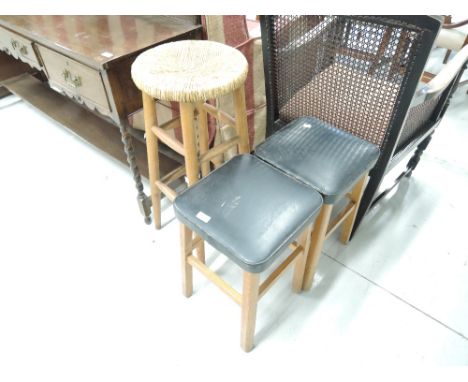 Two traditional stools and a tall bar stool