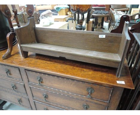 An early 20th Century oak book trough