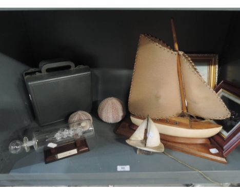 A selection of nautical themed items including 50's style ship light
