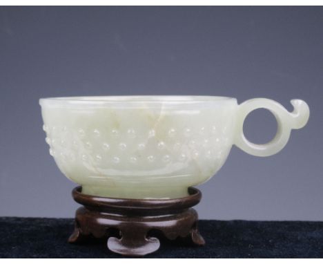 A Chinese archaisitic Jade Libation Cup. 18th/19th Century, of pale celadon tone, of gentle U-form and of archaic style with 