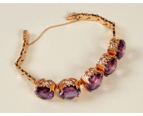 An Amethyst Bracelet, the front having five hinged pierced links each claw-set round mixed-cut stone on box clasp