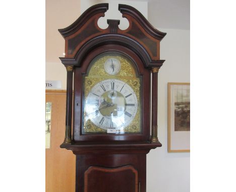 An Edwardian mahogany Longcase Clock by Hampton &amp; Sons, Pall Mall East, London, having arched brass dial, three train, ei
