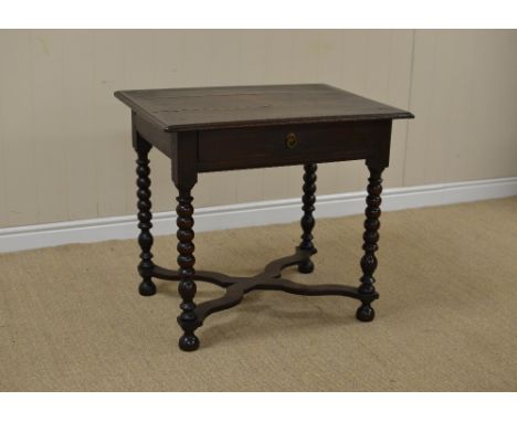 A William and Mary oak Side Table with cleated top, fitted frieze drawer on bobbin turned legs united by flat section X stret