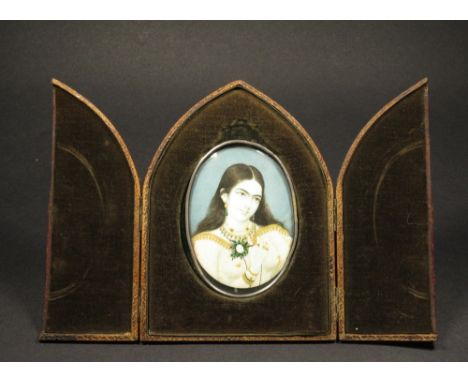 Indian School (19th century), portrait miniature of a lady with long black hair holding a white rose, wearing jewelled ear, n